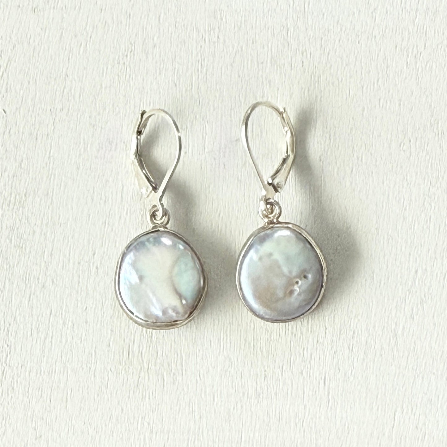 snuggled in pearl earrings