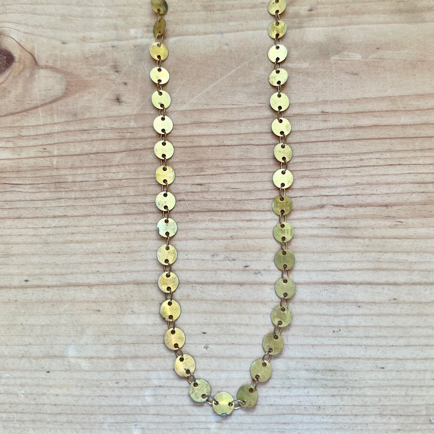brass eyes necklace