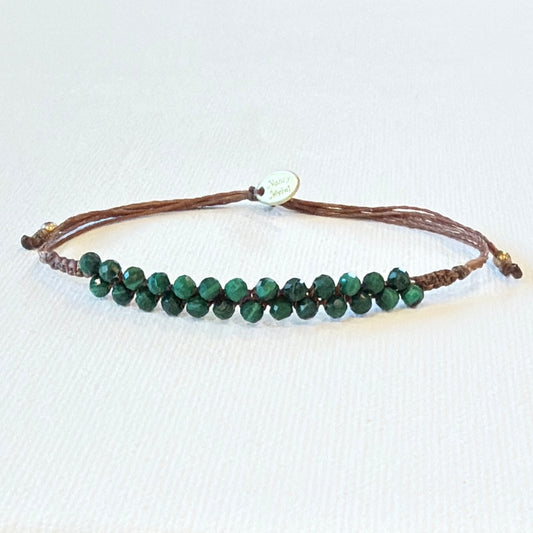 tiny faceted malachite gemstones. Brown waxed nylon and brass.